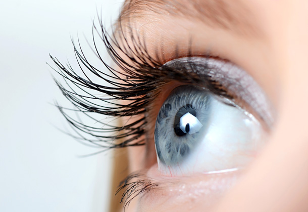 A close up colour photo of a blue eye with long eyelashes , representing the eye treatment page of Vicki Hooper Beautician website - Eye lash and eye brow tinting and LVL enhance - Grayshott & Headley Down